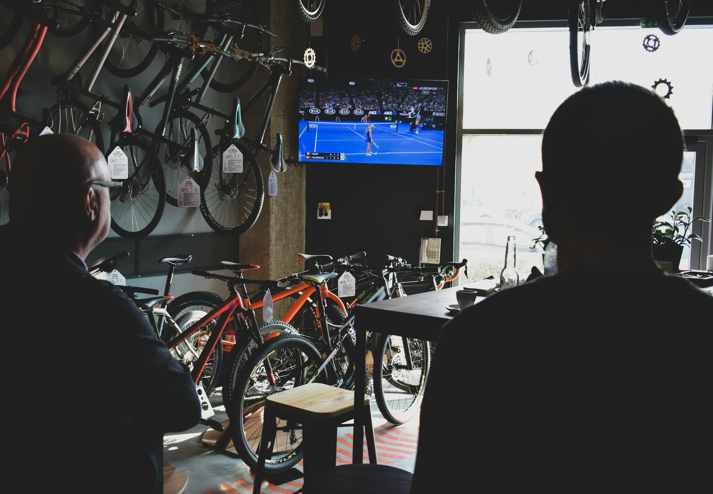 A mechanic working on a bike in their workshop